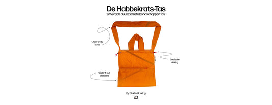 Bright orange Studio Haering upcycled crossbody tote bag called ‘De Habbekrats-Tas’, featuring elastic closure, water-repellent material, and adjustable strap — promoted as the world’s most sustainable shopping bag.